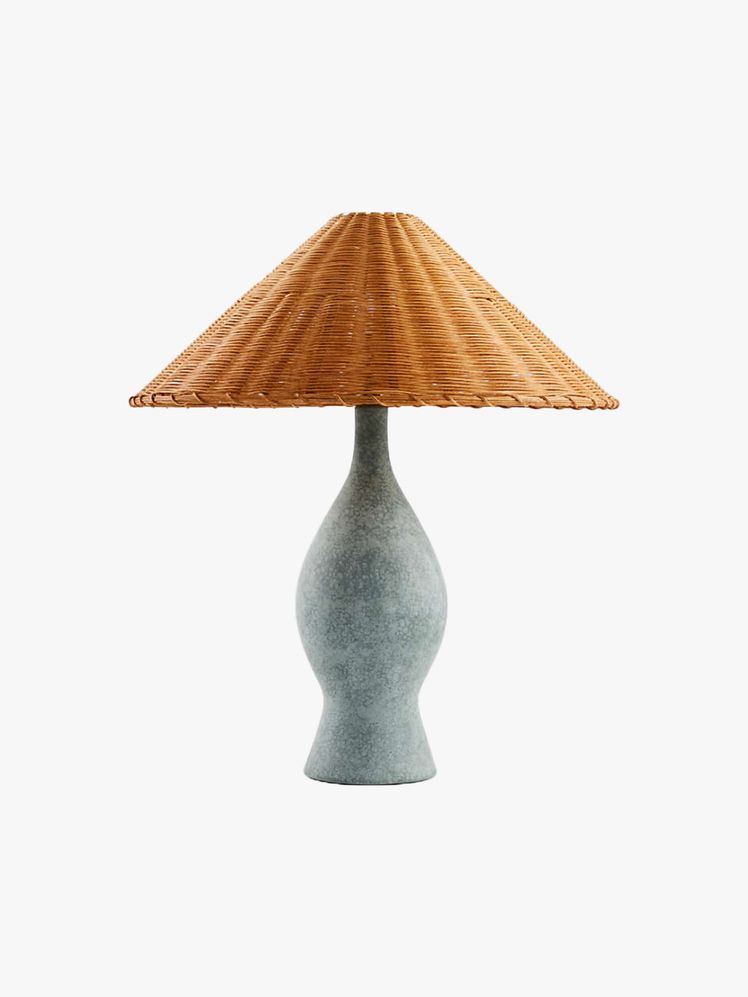 Table lamp with bottleshaped with reactive glaze in a matte rustic green and an angled taper shade woven out of natural...